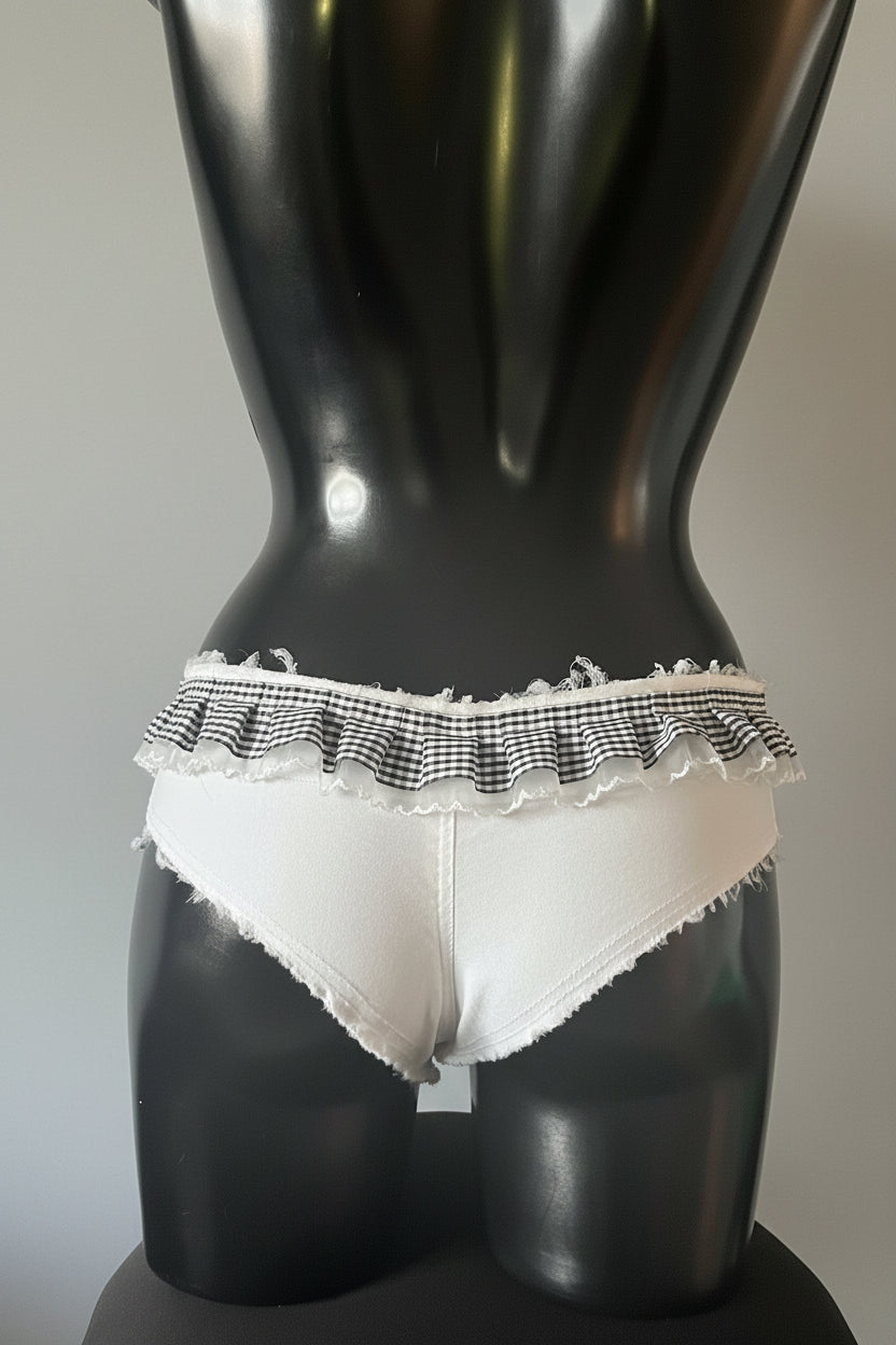 Gang of Divas White low-rise denim briefs with a black and white gingham ruffle waistband.