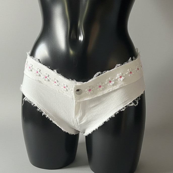 White frayed denim briefs with embroidered pink and white flowers and lace trim
